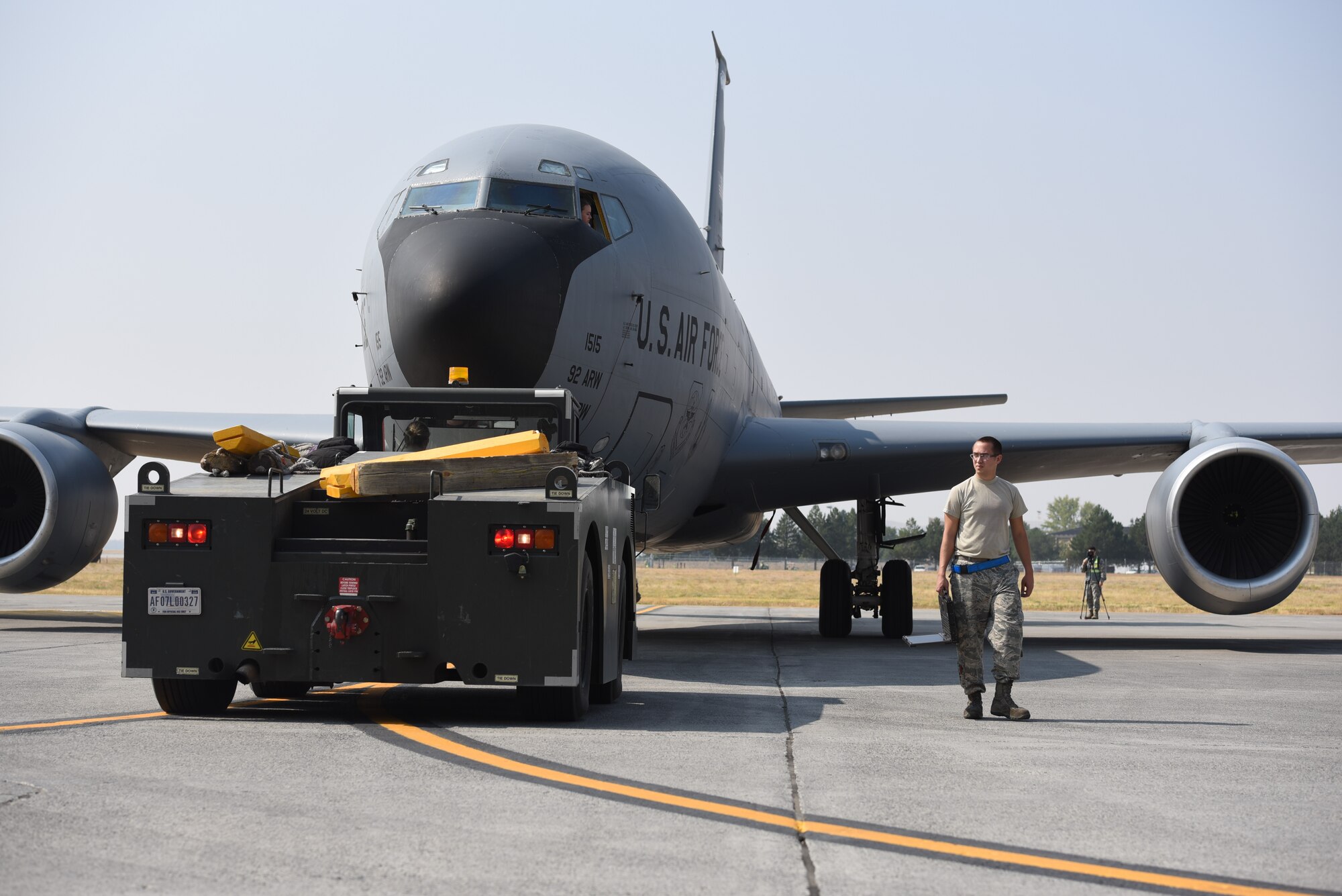 Senior Airman Tyler Turoczy, 92nd Maintenance Squadron crew chief, helps park a KC-135 Stratotanker, assigned to the 92d Air Refueling Wing, Aug. 22, 2018, at Fairchild Air Force Base, Washington. Titan Fury is a readiness exercise used to validate and enhance Fairchild Airmen’s ability to provide Rapid Global Mobility as required by the U.S. Strategic Command and U.S. Transportation Command. (U.S. Air Force photo by Airman 1st Class Lawrence Sena)