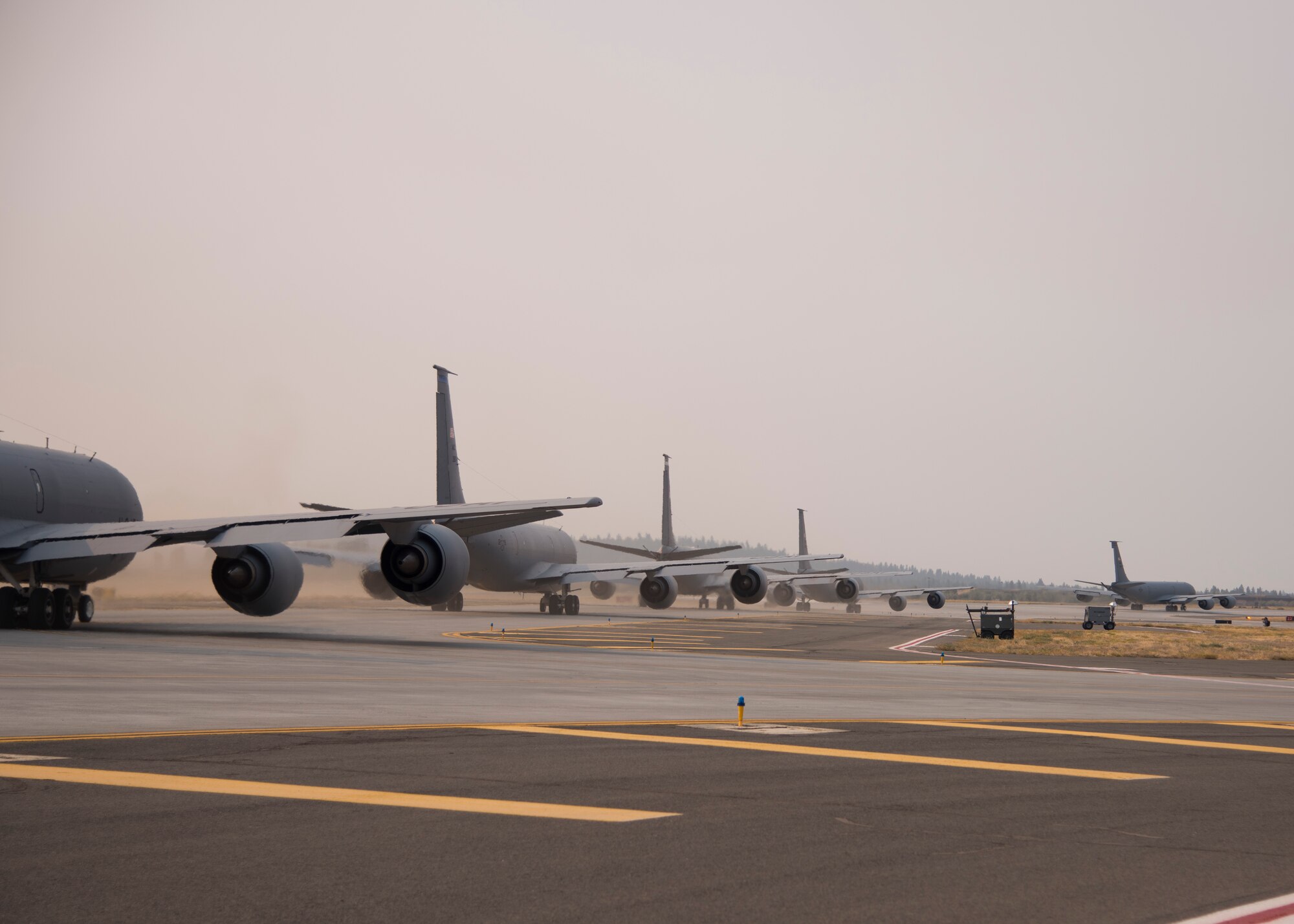 KC-135 Stratotankers line up to launch during a base exercise at Fairchild Air Force Base, Washington, Aug. 24, 2018. Fairchild’s KC-135 Stratotankers have been utilized for decades to extend the reach of fighters, bombers and other aircraft through aerial refueling. Because of this “air bridge,” U.S. and allied air power can be projected around the world 24/7, 365 days a year. (U.S. Air Force photo/Senior Airman Ryan Lackey)