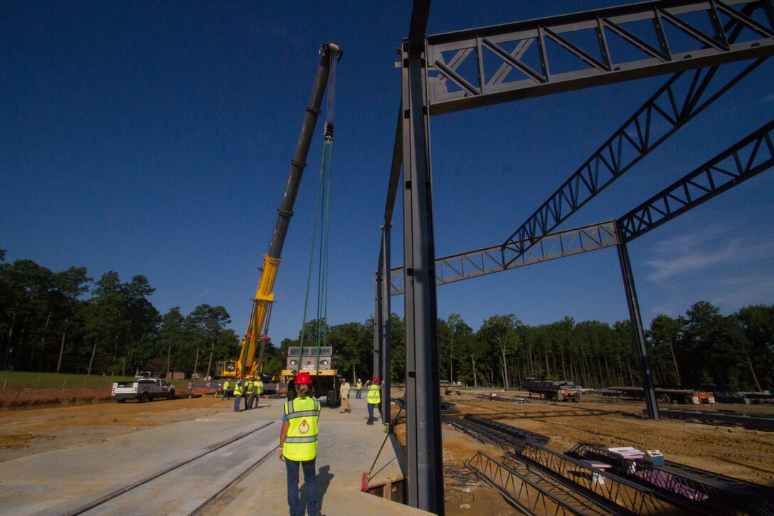 Contractors move "Atomic Annie", an M65-series self-propelled artillery piece into plave at the new Ordnance Training and Heritage Center Building August 8, 2018.