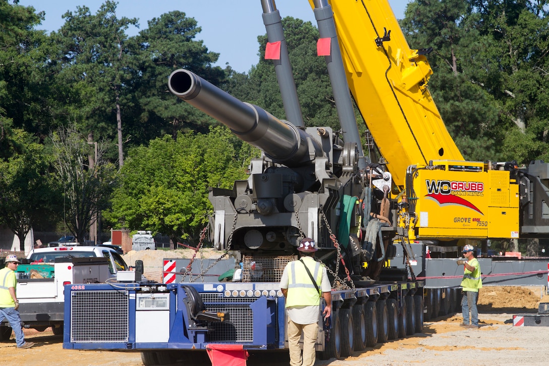 Contractors move "Atomic Annie", an M65-series self-propelled artillery piece into plave at the new Ordnance Training and Heritage Center Building August 8, 2018.