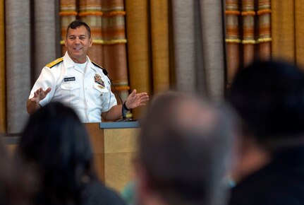 Rear Adm. Stephen Williamson, the Naval Sea Systems Command deputy commander for logistics, maintenance, and industrial operations, addresses attendees at the command’s Lean Six Sigma Black Belt graduation ceremony Aug. 24 at the Norm Dicks Government Center in Bremerton, Wash