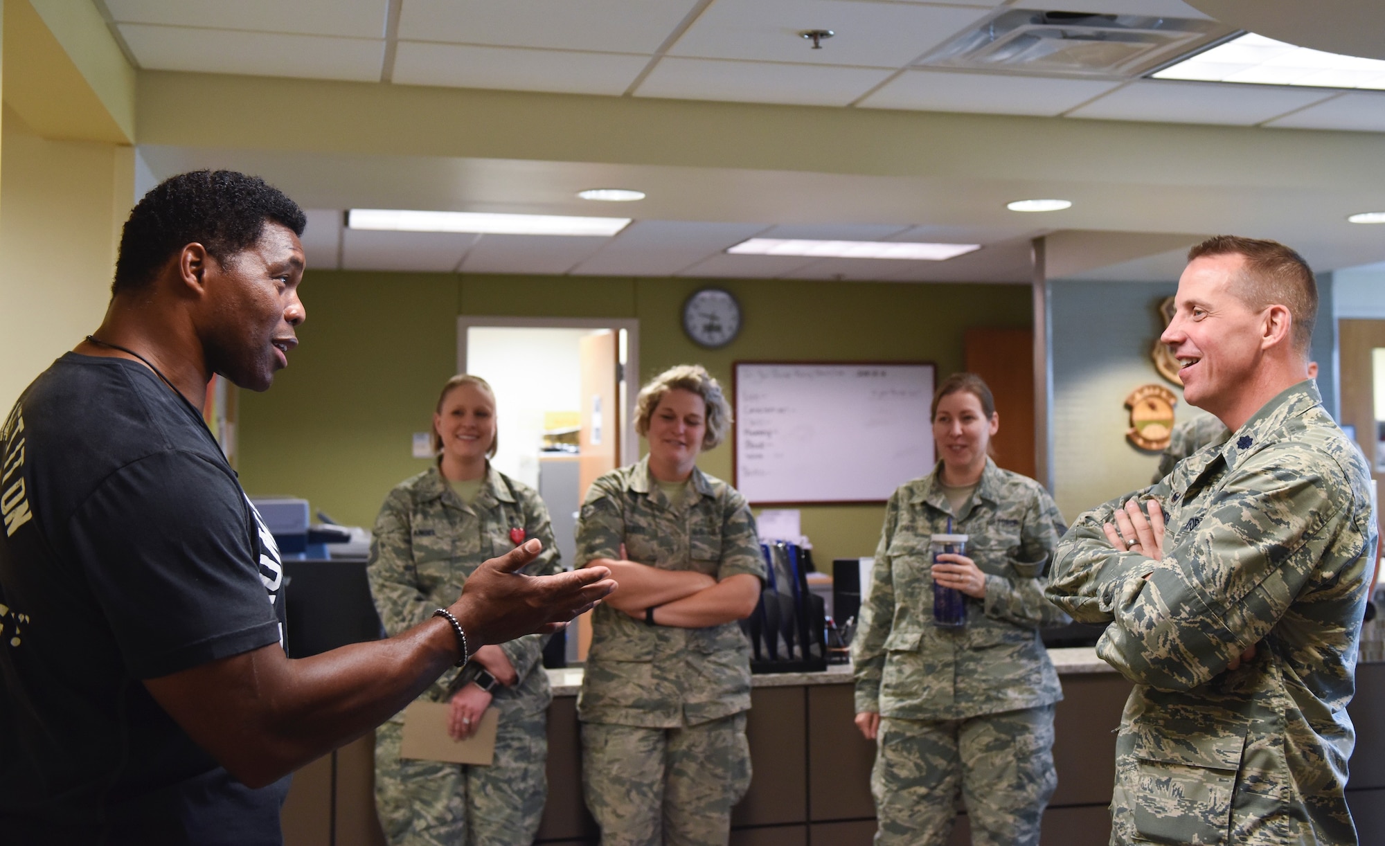 Herschel Walker, college football hall-of-fame star, speaks with Airmen from the 460th Medical Group Aug. 15, 2018, on Buckley Air Force Base, Colorado. Walker visited Buckley AFB to share his story and experience with mental illness and to let Airmen know it is okay to seek help. (U.S. Air Force photo by Airman 1st Class Michael D. Mathews)