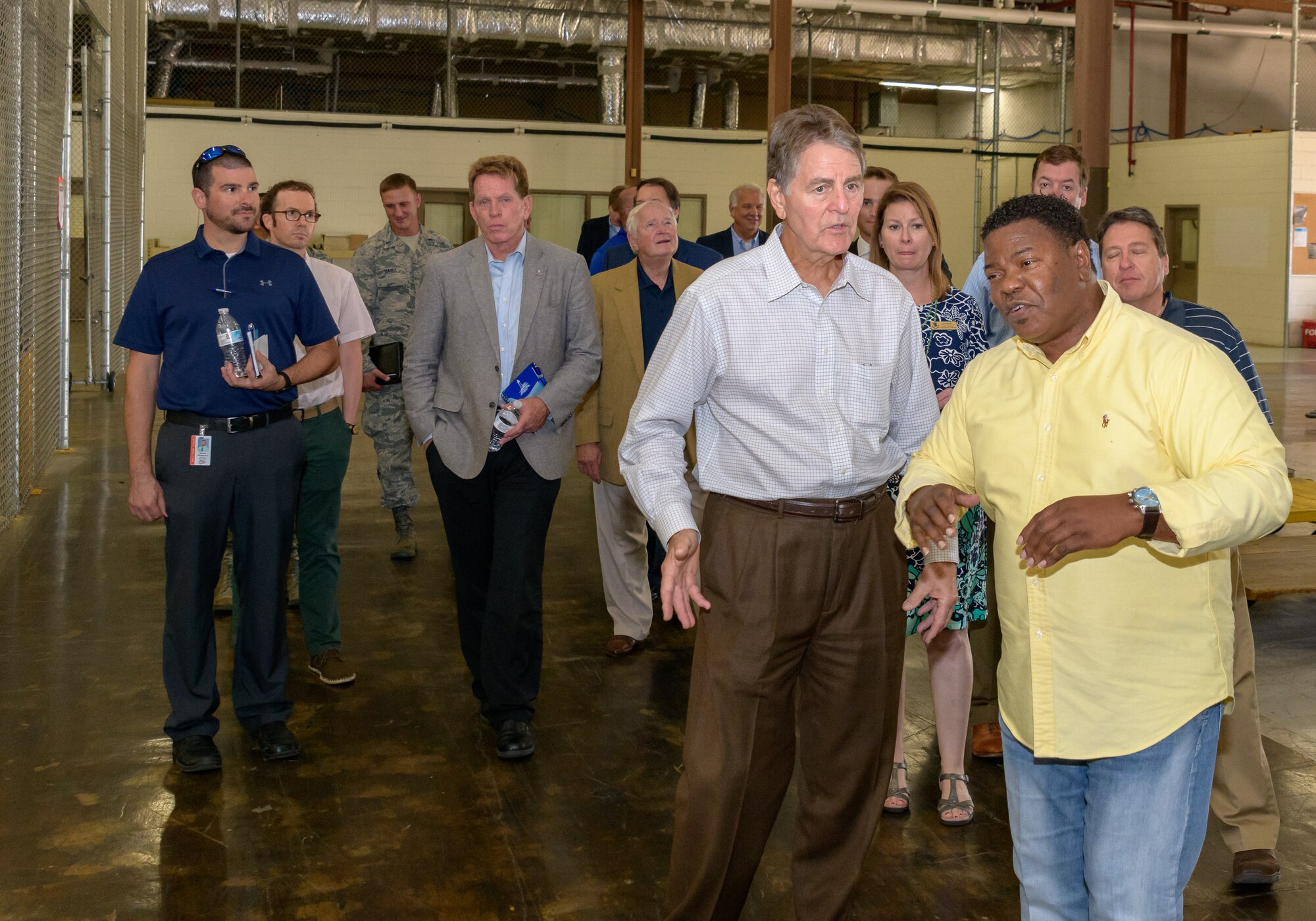 Mr. Mark Pollock, Vectrus supply manager, leads a facility tour during the 81st Mission Support Group Honorary Commanders tour at the Taylor Logistics Center at Keesler Air Force Base, Mississippi, Aug. 23, 2018. The honorary commander program is a partnership between base leadership and local civic leaders to promote strong ties between military and civilian leaders. (U.S. Air Force Photo by Andre' Askew)