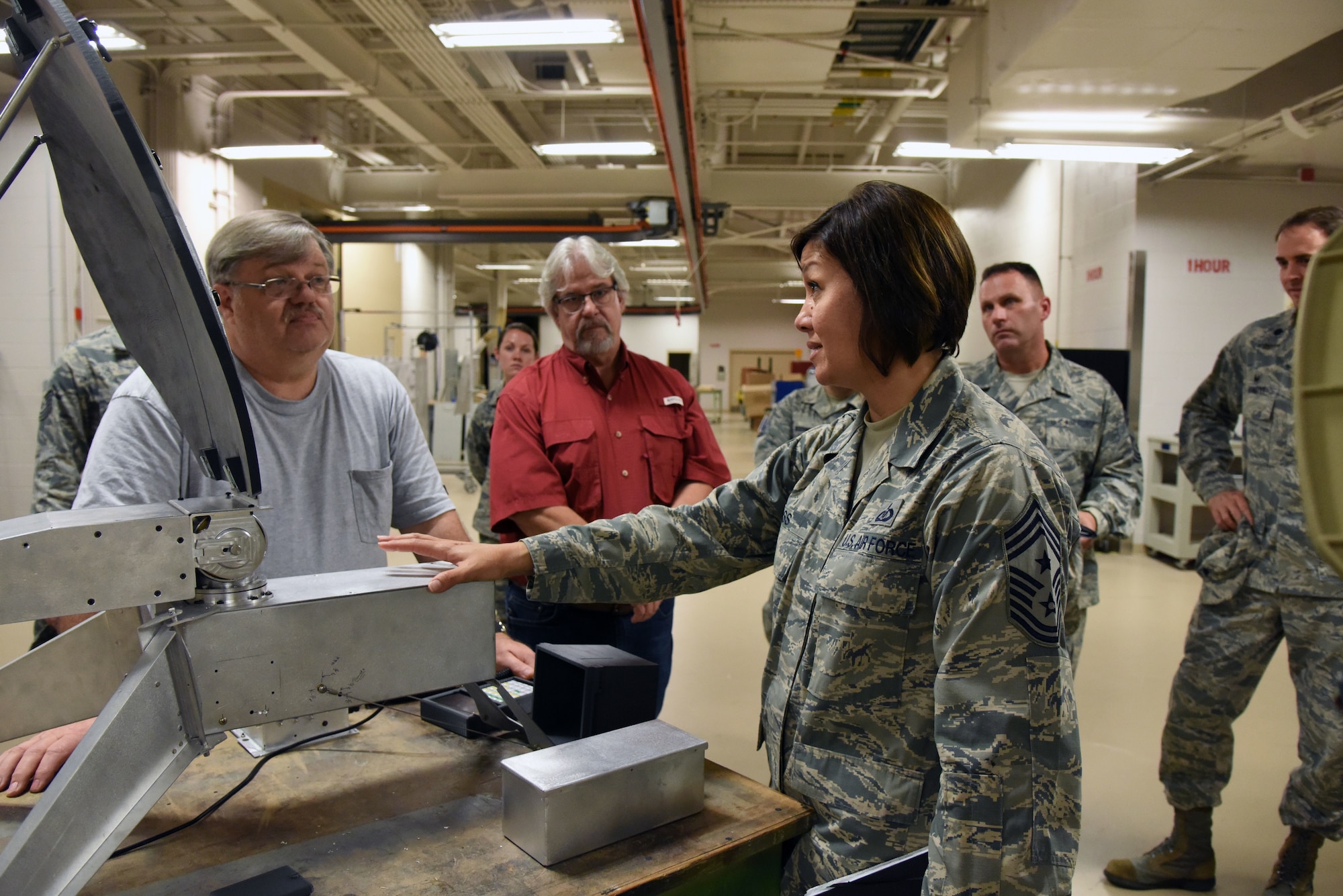 Chief Master Sgt. JoAnne Bass, 2nd Air Force command chief, receives a briefing on the Trainer Development Center's capabilities during an immersion tour on Keesler Air Force Base, Mississippi, Aug. 23, 2018. Bass's one-day tour also included the Keesler Medical Center, 81st Mission Support Group and Wing Staff Agency. (U.S. Air Force photo by Kemberly Groue)