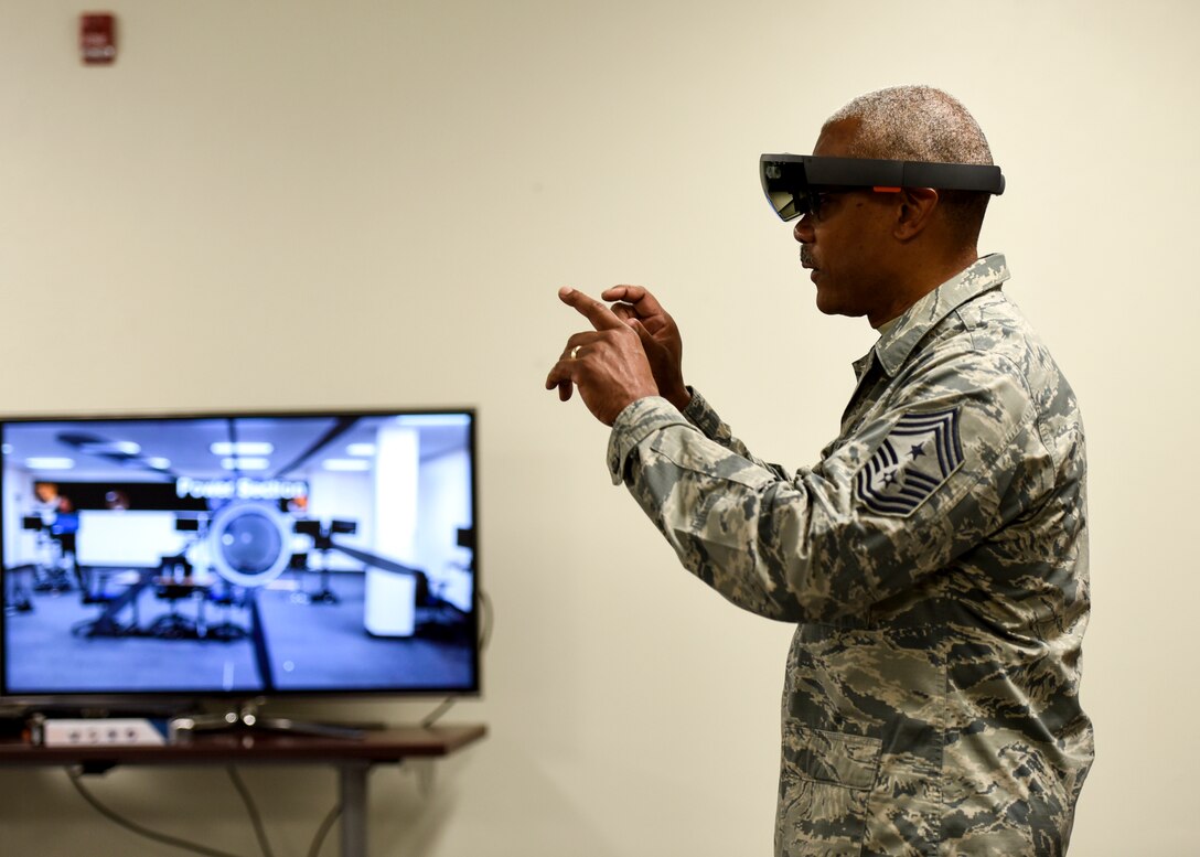 CMSgt. Jack Johnson Jr. interacts with a virtual engine at the Digital Design Lab at Sheppard AFB