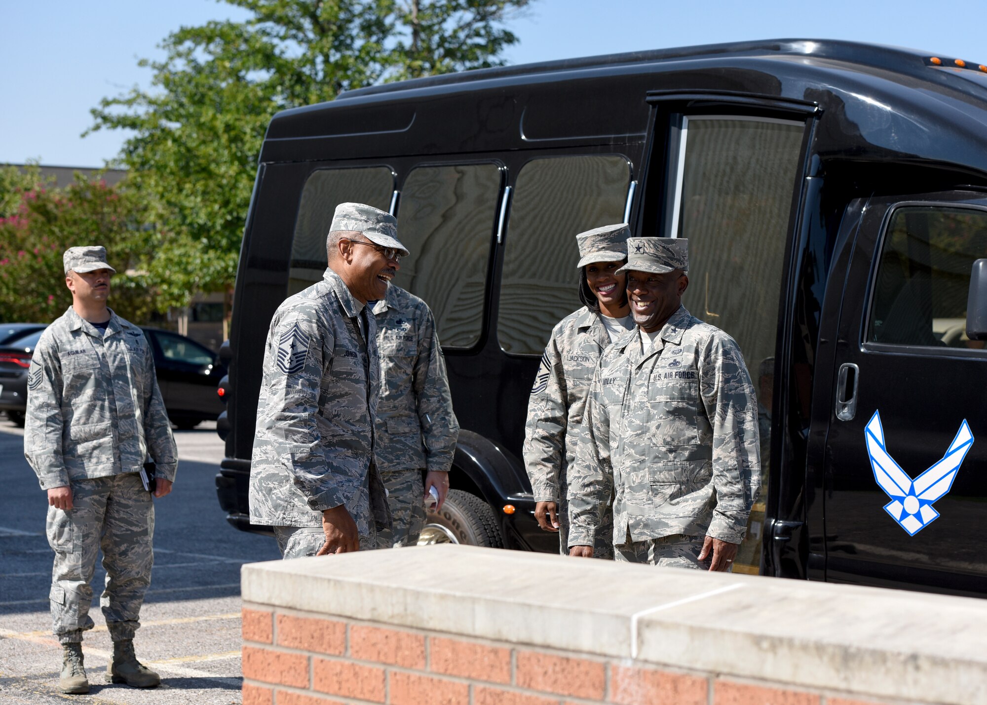 Everyone from the General to the MSgts. all laugh at CMSgt. Jack Johnson Jr.'s joke.