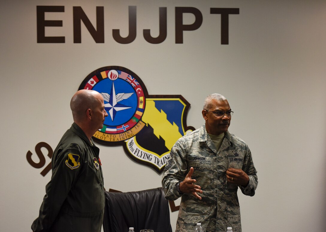 Col. Russell Driggers stands by CMSgt. Jack Johnson Jr. during his visit to the 80th Flying Wing to check up on the EJJPT program run by NATO.
