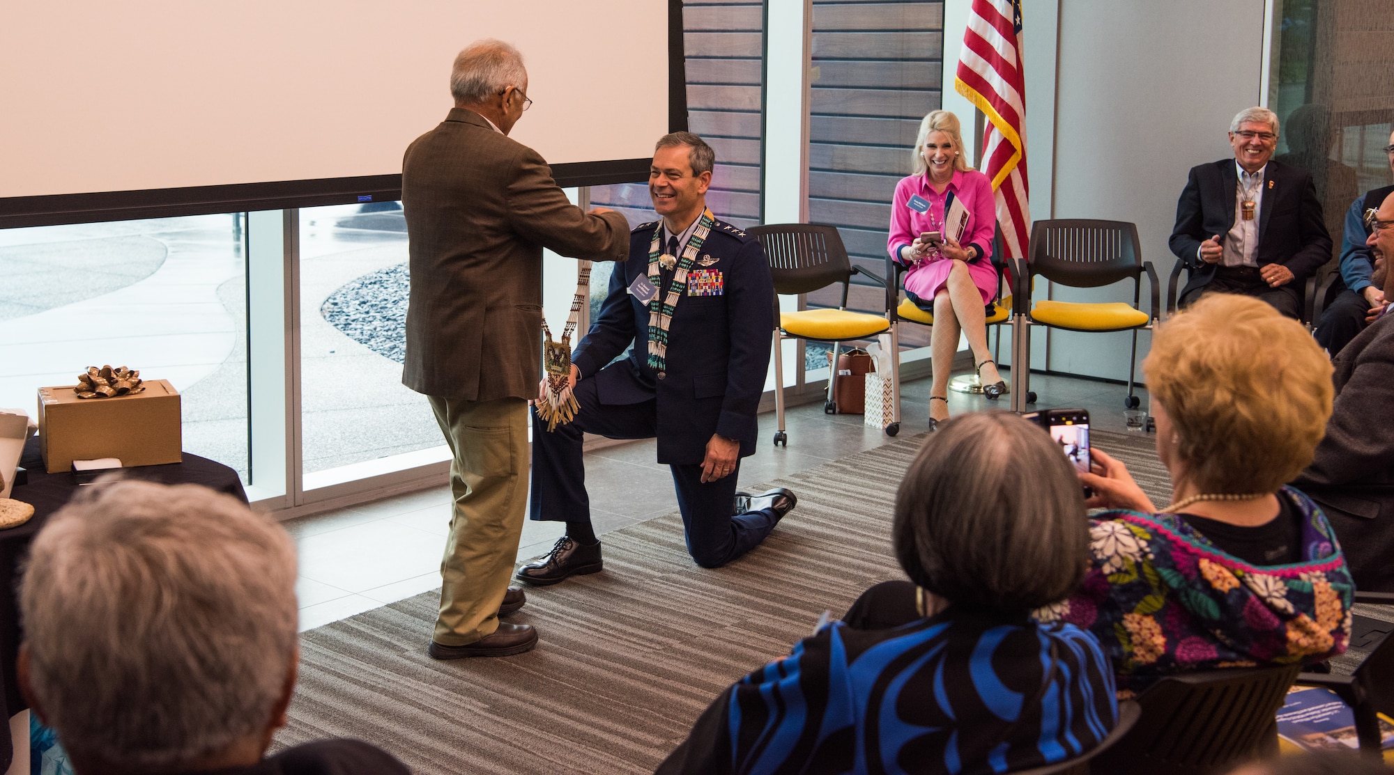 Emil Notti, Alaskan Federation of Natives council member, presents a chief’s necklace to U.S. Air Force Lt. Gen. Ken Wilsbach, commander of Alaskan NORAD Region, Alaskan Command and Eleventh Air Force, during a Native Alaska naming ceremony at the Fireweed Convention Center in Anchorage, Alaska, Aug. 21, 2018. AFN hosted the unique event honoring Wilsbach for his service and involvement with Native Alaskan communities during his tenure in Alaska. It marked the first time in Alaska Native history a U.S. Armed forces general officer was given multiple Native names.