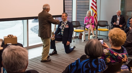 Emil Notti, Alaskan Federation of Natives council member, presents a chief’s necklace to U.S. Air Force Lt. Gen. Ken Wilsbach, commander of Alaskan NORAD Region, Alaskan Command and Eleventh Air Force, during a Native Alaska naming ceremony at the Fireweed Convention Center in Anchorage, Alaska, Aug. 21, 2018. AFN hosted the unique event honoring Wilsbach for his service and involvement with Native Alaskan communities during his tenure in Alaska. It marked the first time in Alaska Native history a U.S. Armed forces general officer was given multiple Native names.