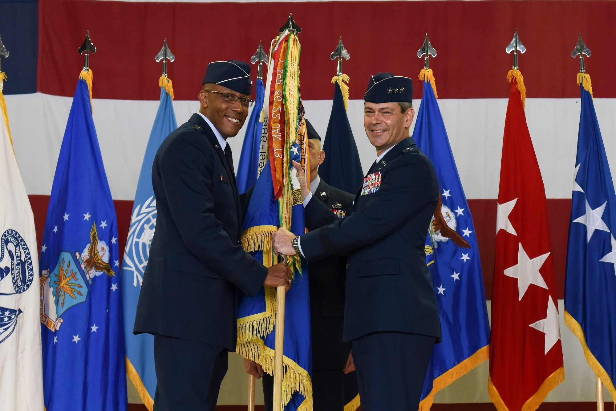 Lt. Gen. Kenneth S. Wilsbach, receives the guideon from Gen. CQ Brown, Jr., Pacific Air Forces commander, as he assumes command and becomes the Deputy Commander, U.S. Forces Korea/ Commander, Air Component Command, United Nations Command/Air Component Command, Combined Forces Command/7th AF, Pacific Air Forces, Osan AB, Republic of Korea (U.S. Photo by Senior Airman Savannah L. Waters)