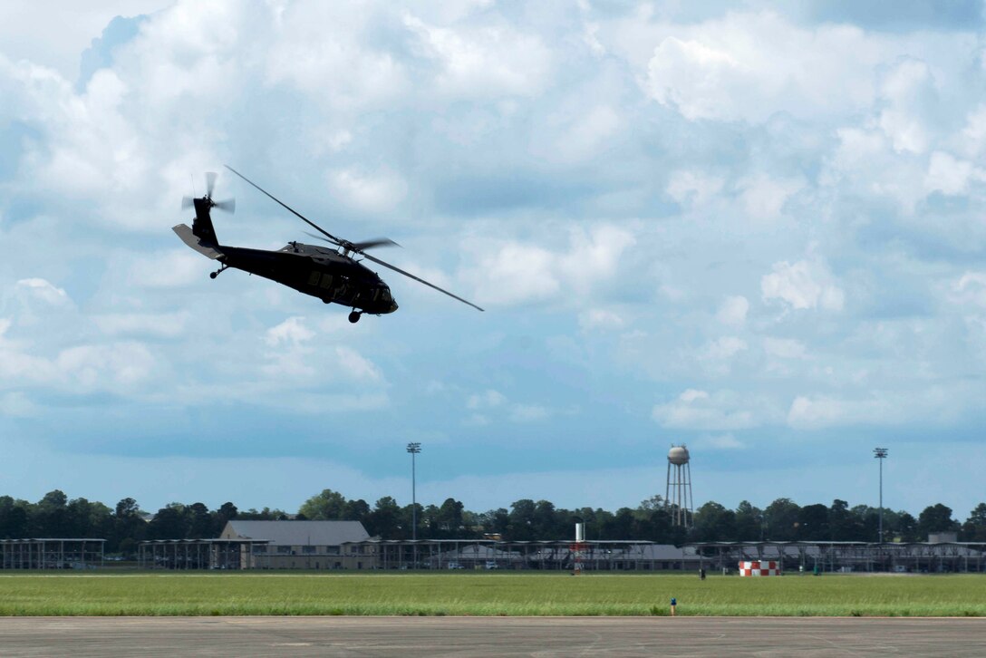 U.S. Air Force Airmen assigned to the 20th Civil Engineer Squadron explosive ordnance disposal flight fly on a UH-60 Black Hawk helicopter assigned to McEntire Joint National Guard Base at Shaw Air Force Base, S.C., Aug. 20, 2018.