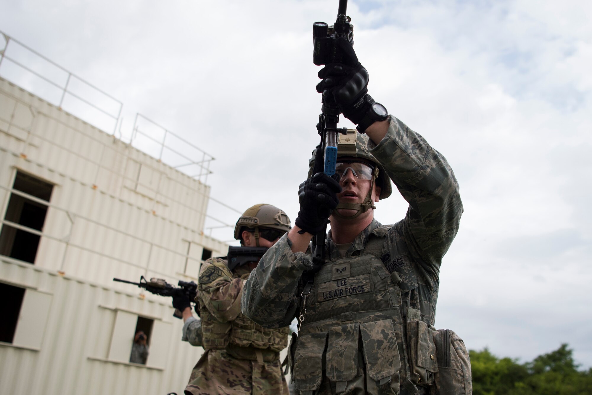 U.S. Air Force security forces Airmen clear buildings during Air Combat Command’s Defender Challenge team selection at Joint Base Langley-Eustis, Virginia, Aug. 20, 2018.