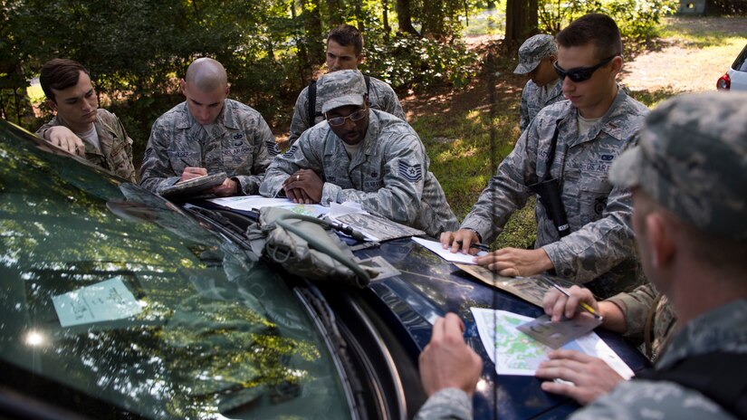 U.S. Air Force security forces Airmen gather prior the land navigation test, during Air Combat Command’s Defender Challenge team selection at Joint Base Langley-Eustis, Virginia, Aug. 23, 2018.