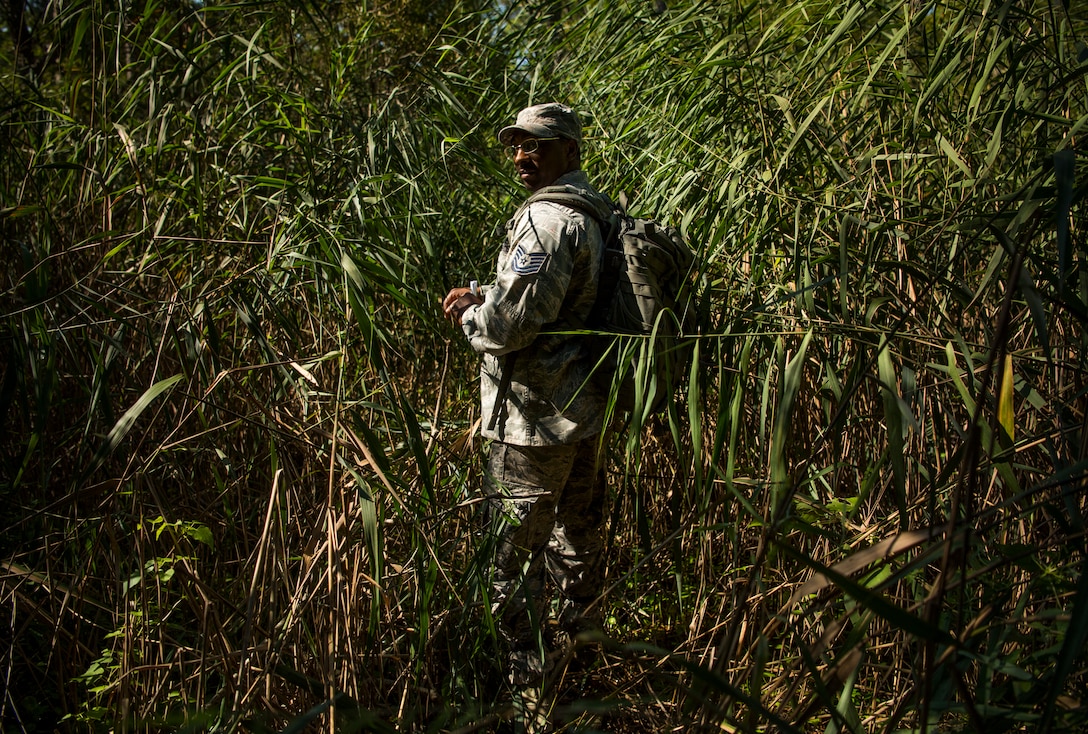 U.S. Air Force Tech. Sgt. Alexis Rice, Air Combat Command Directorate of Logistics, Engineering and Force Protection NCO in charge of mission assurance, observes Air Combat Command security forces Airmen during land navigation as part of the Defender Challenge team selection at Joint Base Langley-Eustis, Virginia, Aug. 23, 2018.