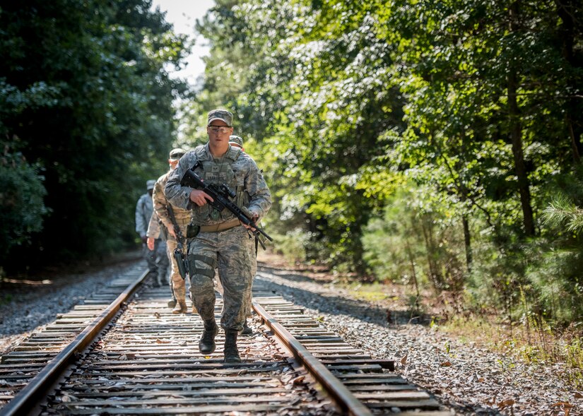 U.S. Air Force security forces Airmen navigate land during Air Combat Command’s Defender Challenge team selection at Joint Base Langley-Eustis, Virginia, Aug. 23, 2018.