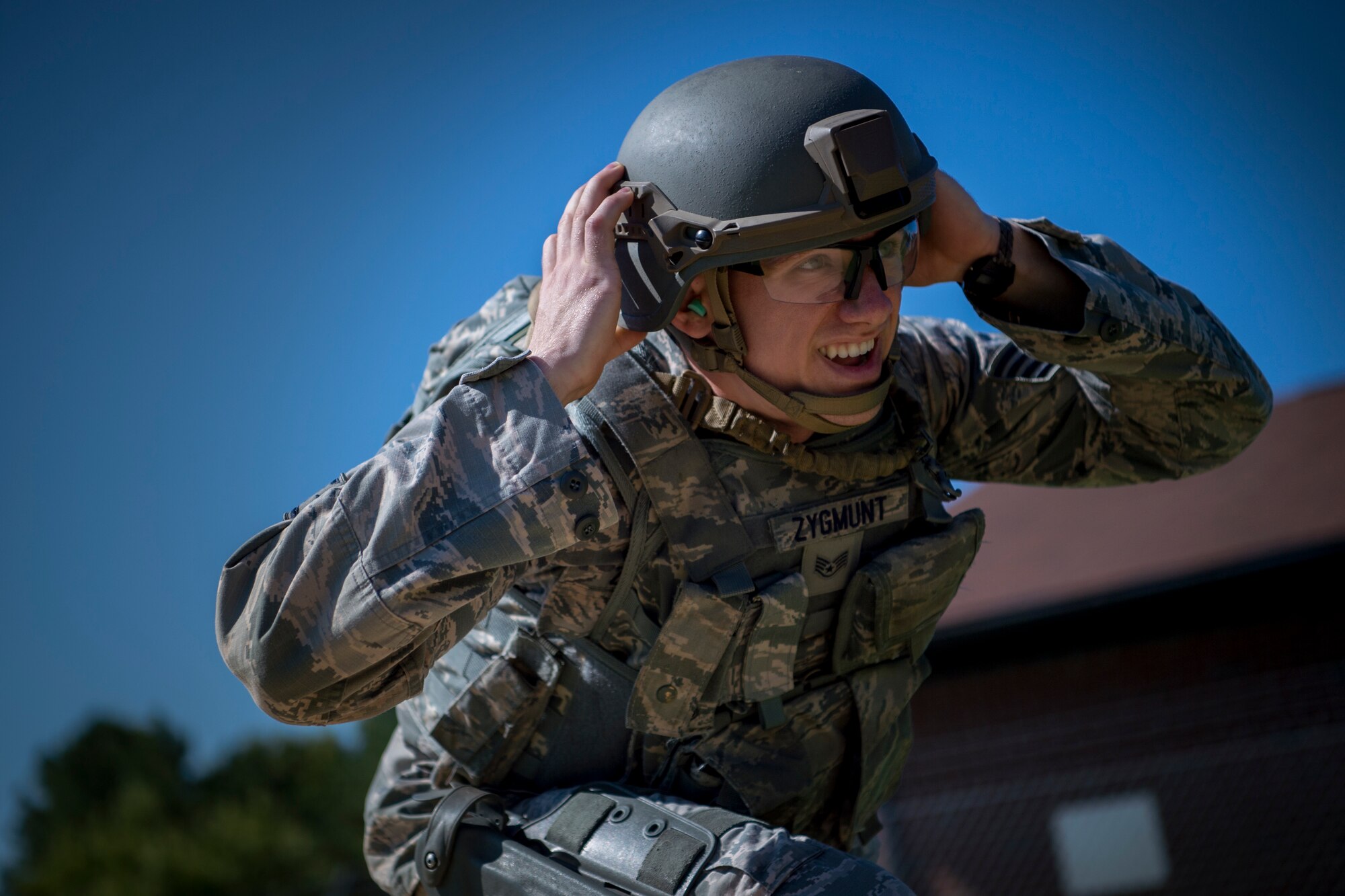 U.S. Air Force Staff Sgt. Anthony Zygmunt, 7th Reconnaissance Squadron alarm monitor, performs physical exercises prior to firing during Air Combat Command’s Defender Challenge team selection at Joint Base Langley-Eustis, Virginia, Aug. 24, 2018.