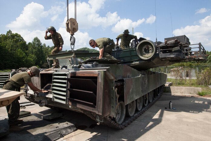 Marines with 1st Tank Battalion, 2nd Tank Bn., and 4th Tank Bn. provide maintenance to an M1A1 Abrams tank in preparation for the 15th annual Tiger Competition, Aug. 27, 2018 in Fort Knox, Kentucky.