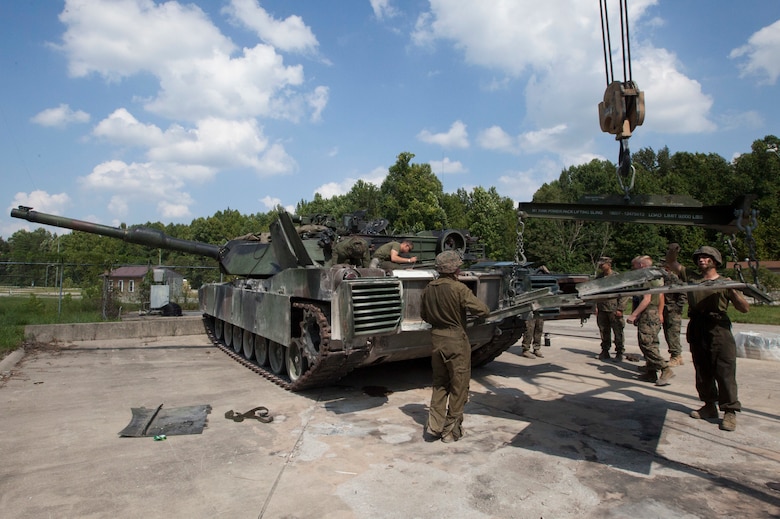 Marines with 1st Tank Battalion, 2nd Tank Bn., and 4th Tank Bn. provide maintenance to an M1A1 Abrams tank in preparation for the 15th annual Tiger Competition, Aug. 27, 2018 in Fort Knox, Kentucky.