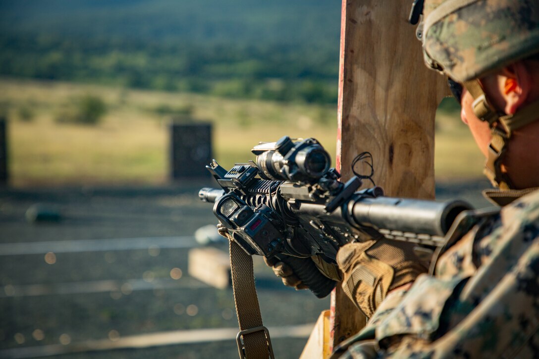 A U.S. Marine with Black Sea Rotational Force 18.1 conducts a tactical reload while executing an advanced portion of a Combat Marksmanship Program range during Exercise Platinum Lion 18.