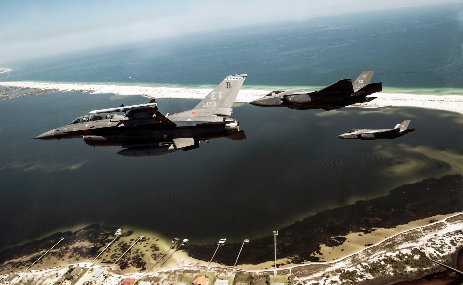 Aircrew from the 40th Flight Test Squadron and the 33rd Fighter Wing perform a mixed aircraft flyover near Pensacola Naval Station, Florida.