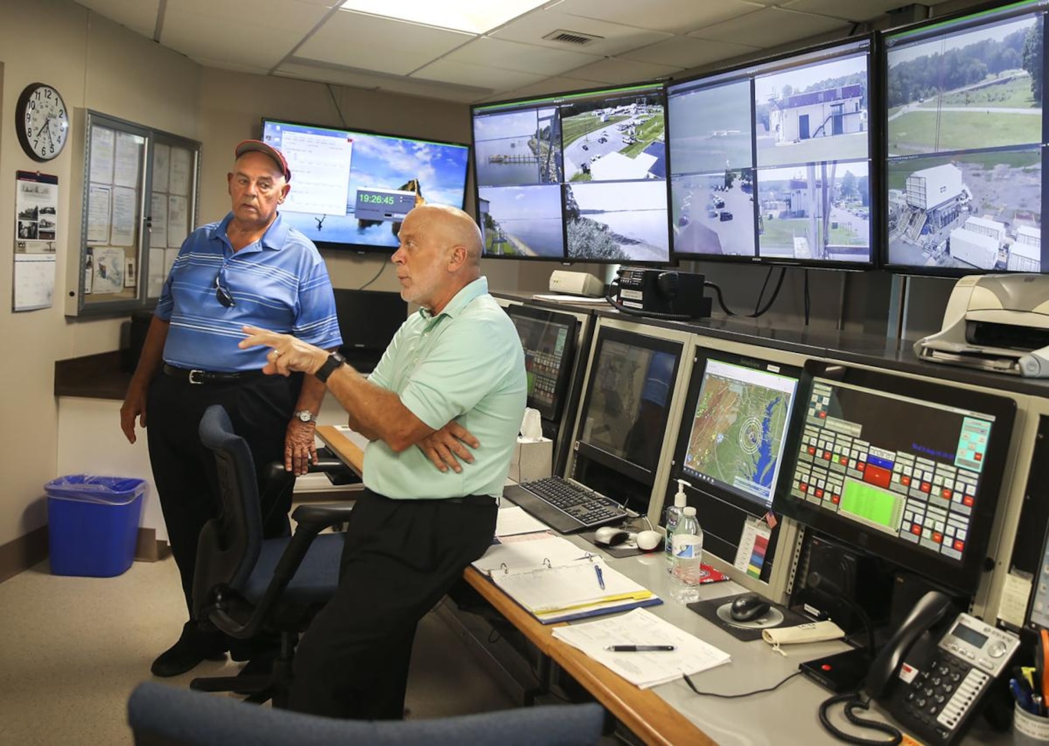 John Elliot (left) and Barry Mohle talk about the changes that have taken place over the years at the Potomac River Test Range at Naval Support Facility Dahlgren. The base is gearing up to celebrate its centennial