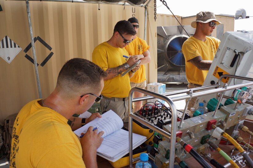 U.S. Army Soldiers assigned the 74th Engineer Dive Detachment monitor the console and charts, tracking every movement of a diver in the Arabian Gulf, July 13, 2018.