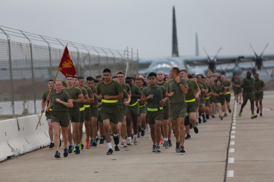 Lt. Col. Michael A. Spears, commanding officer of Headquarters and Headquarters Squadron, Right, leads his Marines on a squadron run at Marine Corps Air Station Miramar, Calif., Aug. 21. Spears led his Marines during a final squadron run before he changes command with Lt. Col. Alan J. Clarke, future commanding officer of H&HS. (U.S. Marine Corps photo by Cpl. Jake M.T. McClung)