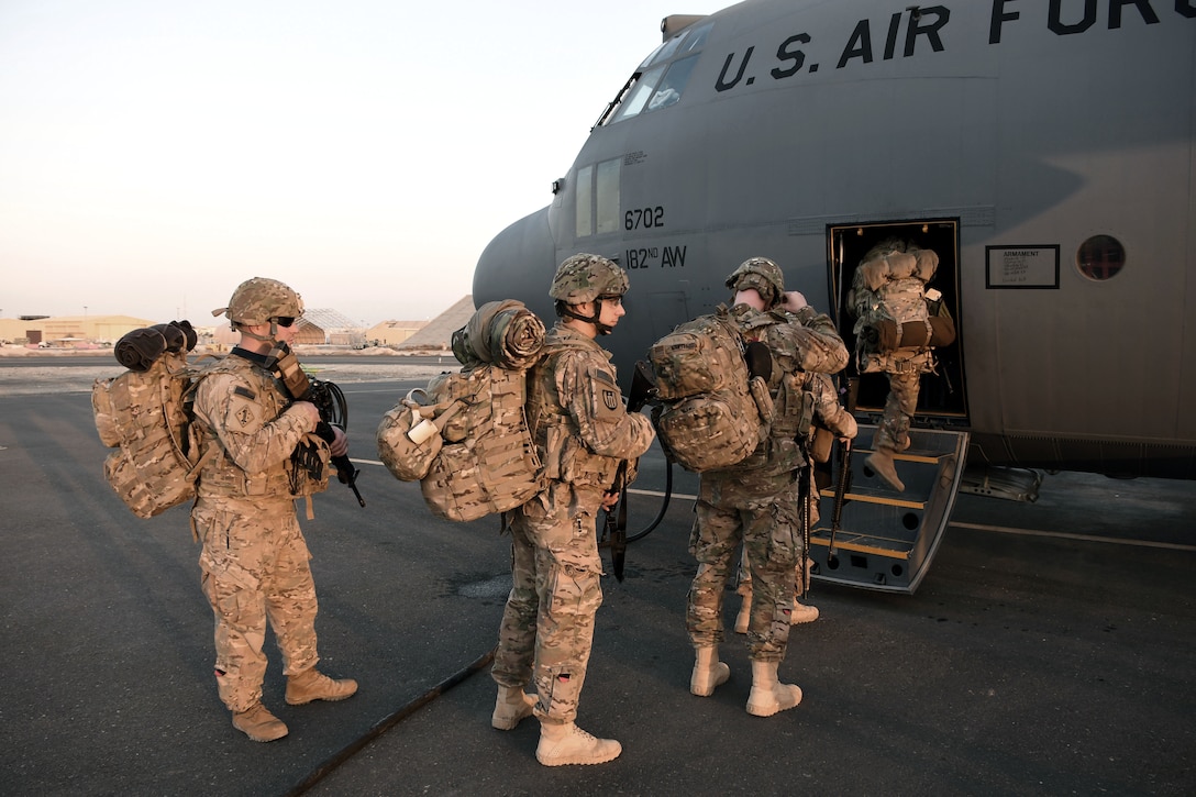 U.S. service members board a C-130H at an undisclosed location in Southwest Asia. The 386th moved an average of nearly 8,000 passengers a month throughout the U.S. Central Command area of responsibility in support of Operation Inherent Resolve.