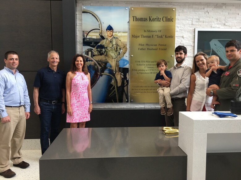 The Koritz family shown in front of the memorial wall at the new Thomas Koritz Clinic, Seymour Johnson Air Force Base, North Carolina. The U.S. Army Corps of Engineers oversaw the construction of the $55 million facility which was named in honor of Air Force Maj. Thomas F. “Teek” Koritz, a flight surgeon and pilot killed in a bombing mission during the Gulf War. (Courtesy photo)