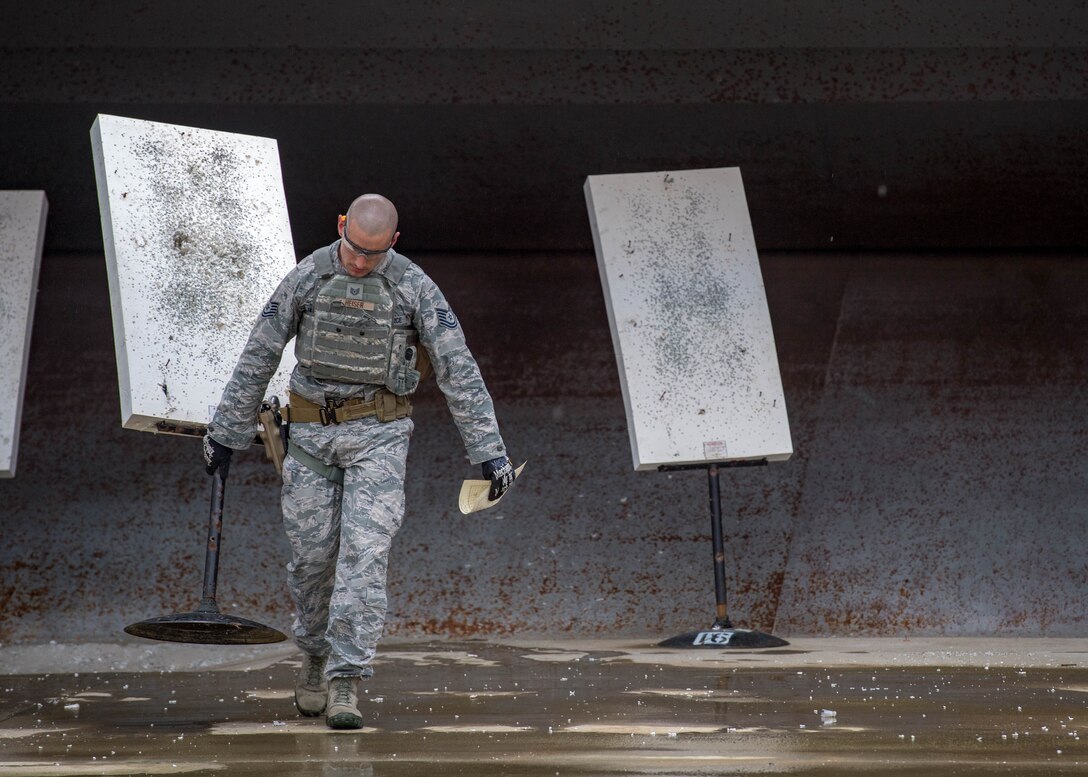 U.S. Air Force Tech. Sgt. Matthew Heiser, 49th Security Forces Squadron flight chief, repositions a target during Air Combat Command’s Defender Challenge team selection at Joint Base Langley-Eustis, Virginia, August 20, 2018.