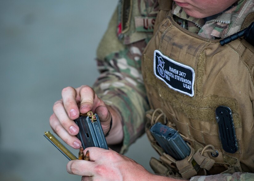 U.S. Air Force Senior Airman Dakota Stevenson, 55th Security Forces Squadron fly away security, loads a magazine during Air Combat Command’s Defender Challenge team selection at Joint Base Langley-Eustis, Virginia, August 20, 2018.
