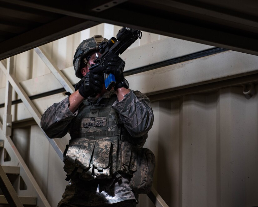 U.S. Air Force Senior Airman Aaron Lee, 9th Security Forces Squadron patrolman, clears a building during Air Combat Command’s Defender Challenge team selection at Joint Base Langley-Eustis, Virginia, August 21, 2018.