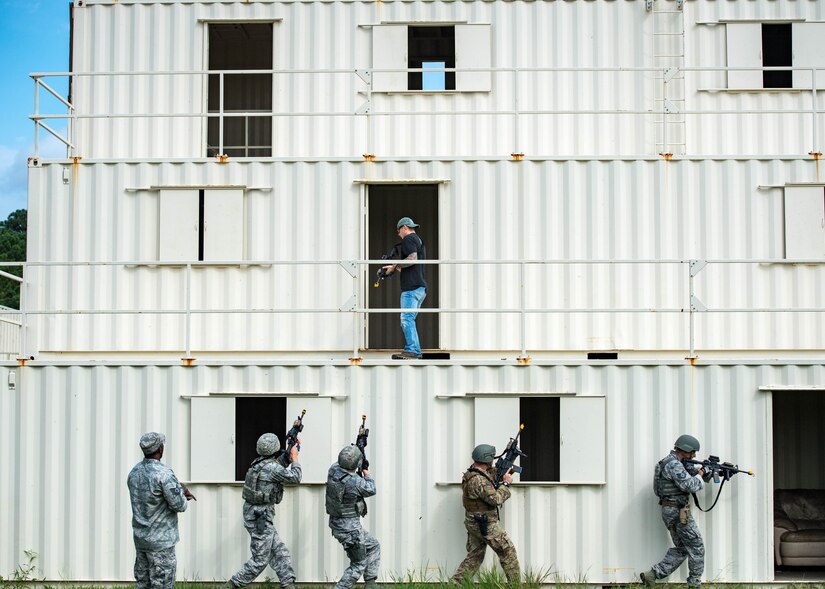U.S. Air Force Airmen perform clear a building during Air Combat Command’s Defender Challenge team selection at Joint Base Langley-Eustis, Virginia, August 21, 2018.