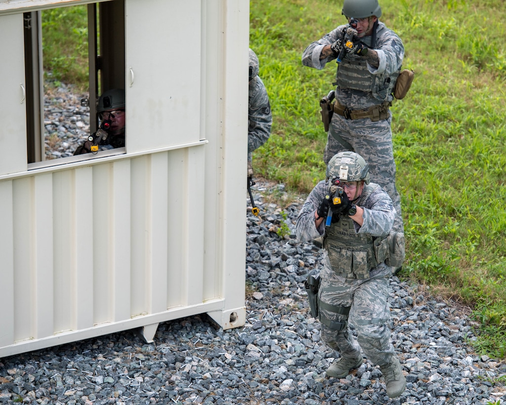 U.S. Air Force Airmen clear a building during Air Combat Command’s Defender Challenge team selection at Joint Base Langley-Eustis, Virginia, August 21, 2018.