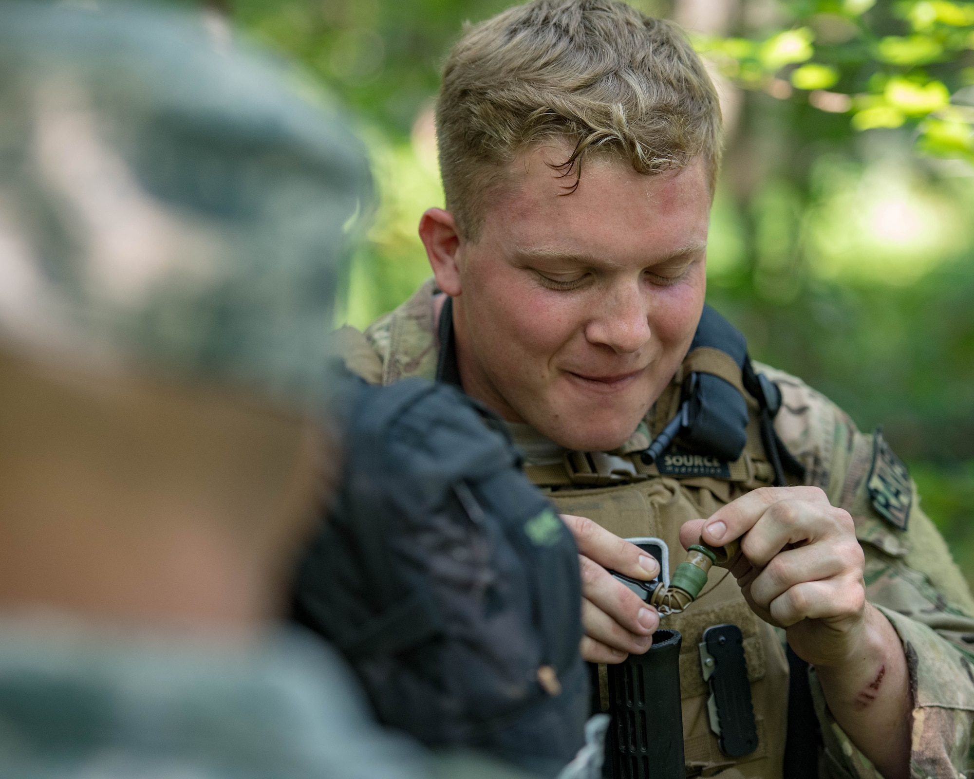 U.S. Air Force Senior Airman Dakota Stevenson, 55th Security Forces Squadron fly away security, hydrates during Air Combat Command’s Defender Challenge team selection at Joint Base Langley-Eustis, Virginia, August 23, 2018.