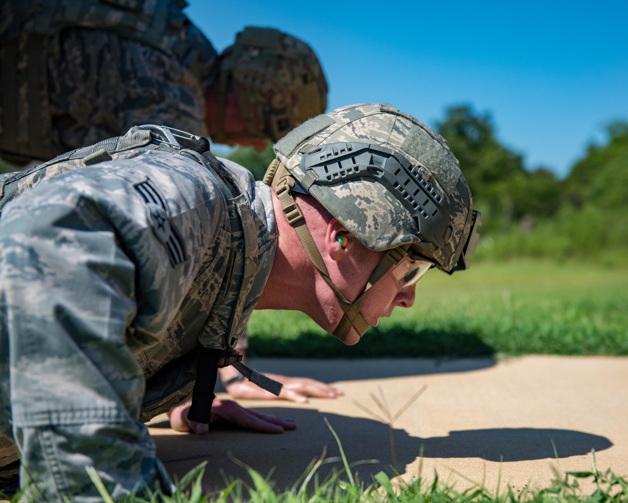 U.S. Air Force Senior Airman Aaron Lee, 9th Security Forces Squadron patrolman, performs pushups during Air Combat Command’s Defender Challenge team selection at Joint Base Langley-Eustis, Virginia, August 24, 2018.