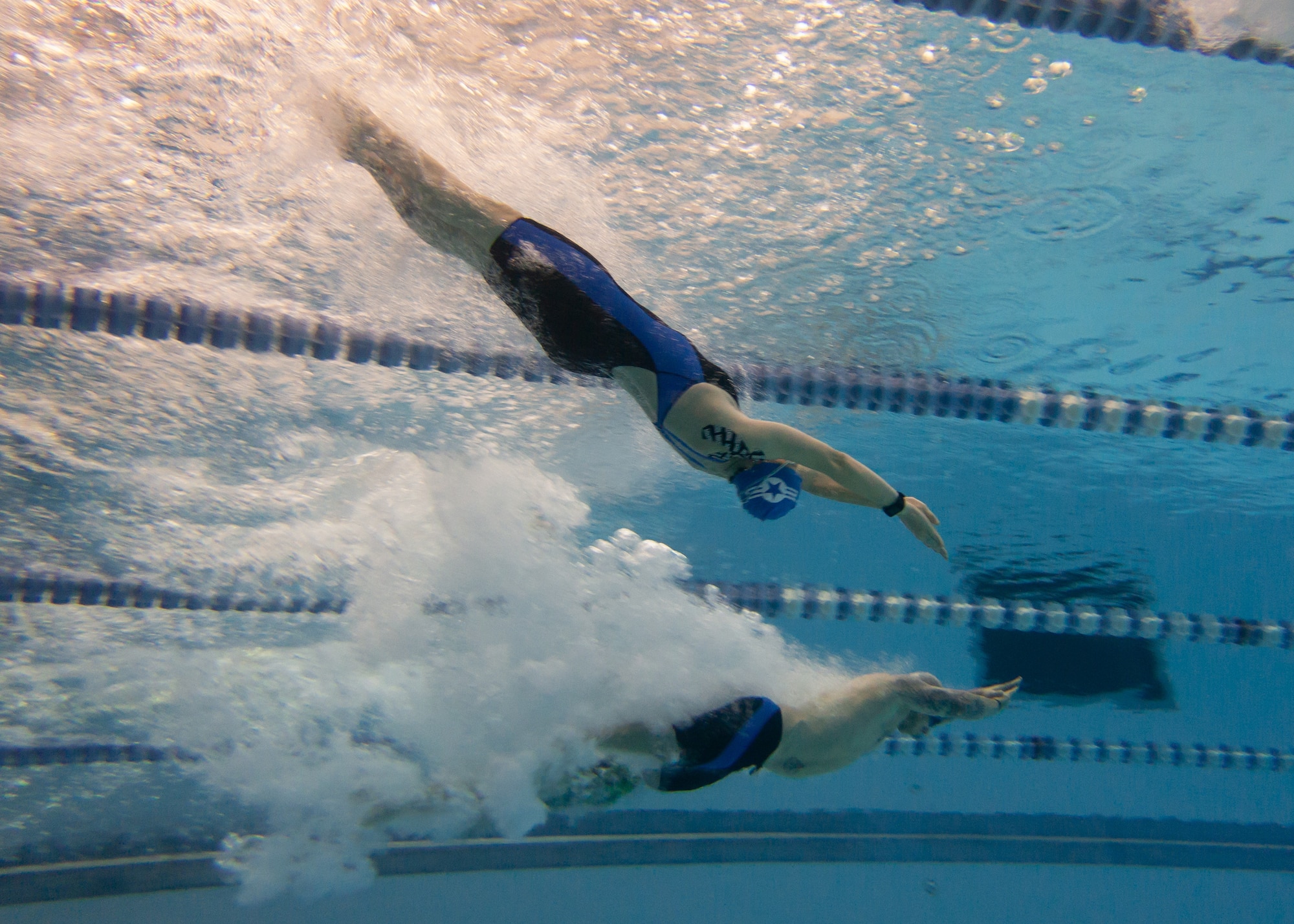 Master Sgt. Lisa Goad, Team Air Force athlete, completes a backstroke dive at the 2018 Department of Defense Warrior Games at the U.S. Air Force Academy in Colorado Springs, Colo. on June 4. The Warrior Games are a Paralympic style athletic competition where Wounded Warriors from all service branches compete against each other. (Photo by Master Sgt. David Long)