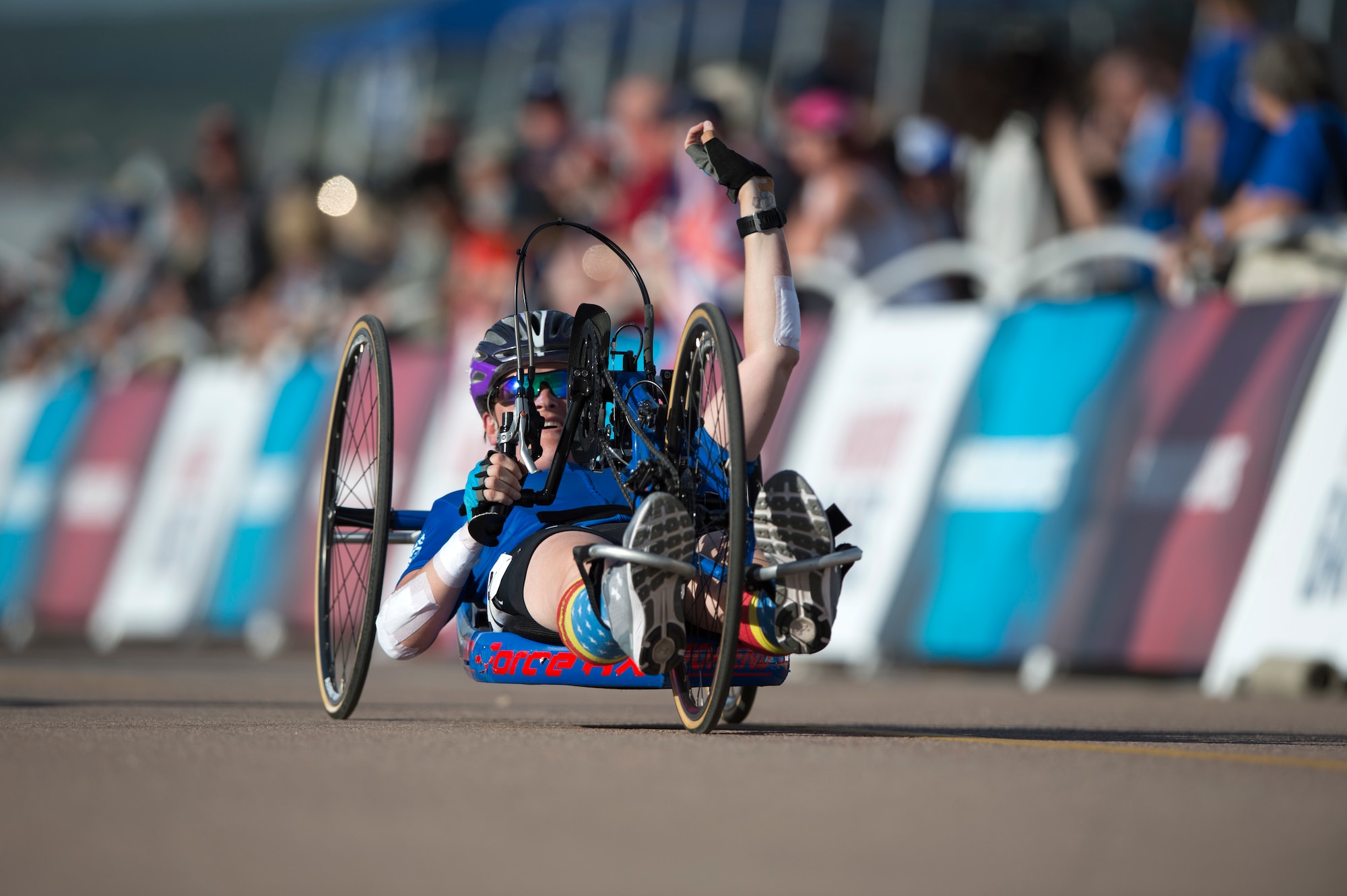 Master Sgt. Lisa Goad, Team Air Force athlete, reacts to finishing the 2018 DoD Warrior Games hand-cycling competition at the U.S. Air Force Academy in Colorado Springs, Colo. on June 6. Goad was involved in a crash during her first hand-cycling race, and took home the silver medal in her second race. (DoD photo by EJ Hersom)