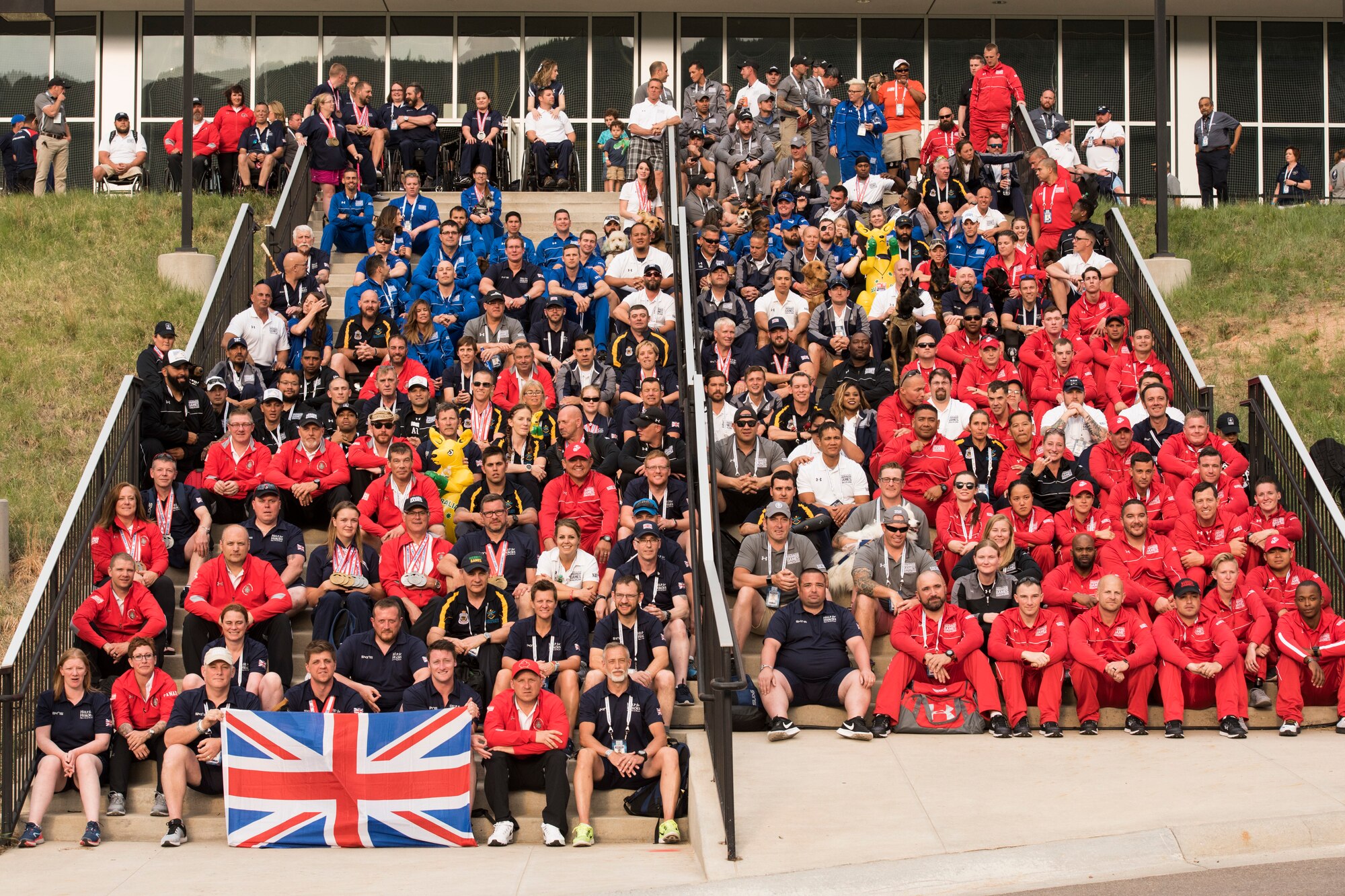 Athletes and staff pose for a team photo at the conclusion of the 2018 DoD Warrior Games at the U.S. Air Force Academy in Colorado Springs, Colo. on June 9, 2018. The Warrior Games are an annual event, established in 2010, to introduce wounded, ill and injured service members to adaptive sports as a way to enhance their recovery and rehabilitation. (DoD Photo by Roger L. Wollenberg)