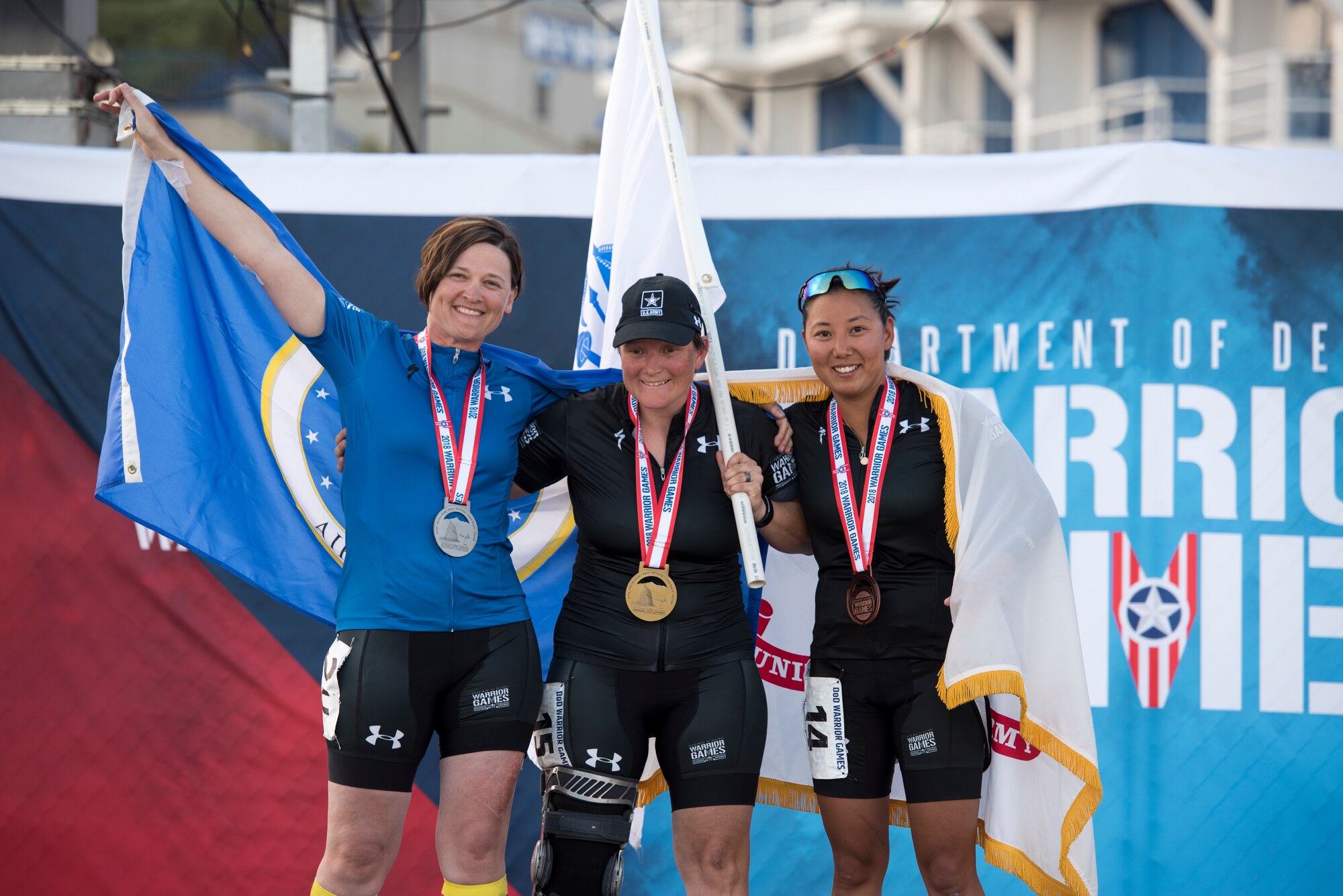 (From left to right) Master Sgt. Lisa Goad, Team Air Force athlete, Sgt. 1st Class Tiffany Rodriguez-Rexroad and Sgt. 1st Class Hyoshin Cha, Team Army athletes, pose for a photo after a hand-cycling race at the U.S. Air Force Academy in Colorado Springs, Colo. on June 6, 2018. Hand cycling was one of the adaptive sports for athletes with lower body limitations featured at the 2018 Department of Defense Warrior Games. (Courtesy photo)