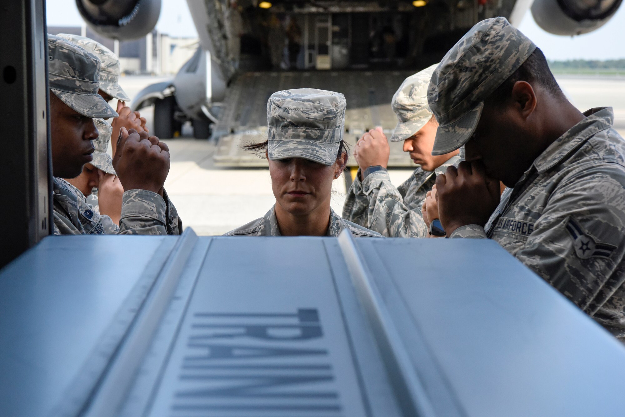 United States Air Force active duty and Reserve Airmen practice their movements during dignified transfer training for Air Force Mortuary Affairs Operations Aug. 23, 2018, at Dover Air Force Base, Del. A dignified transfer is the process by which, upon the return from the theater of operations to the United States, the remains of fallen military members are transferred from the aircraft to a waiting vehicle and then to the port mortuary. (U.S. Air Force photo by Airman 1st Class Zoe M. Wockenfuss)