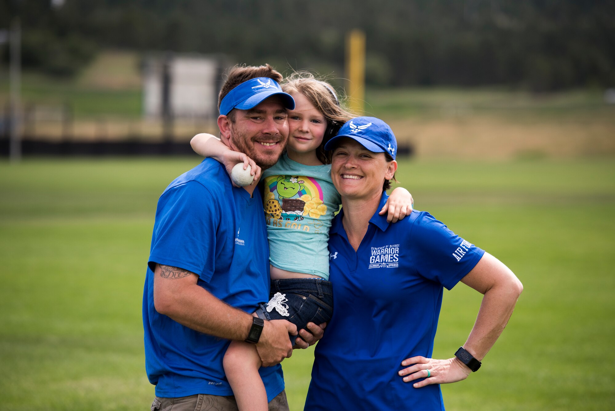 Tech. Sgt. Justin Goad, 49th Security Forces Squadron flight sergeant; Ella Goad, daughter; and Master Sgt. Lisa Goad, 49 SFS Logistic and Resources superintendent and Warrior Games athlete; pose for a photo at the U.S. Air Force Academy in Colorado Springs, Colo. on June 9, 2018. Goad’s family accompanied her to Colorado as she competed for Team Air Force in the 2018 Department of Defense Warrior Games from June 1 to 9. (Courtesy photo)