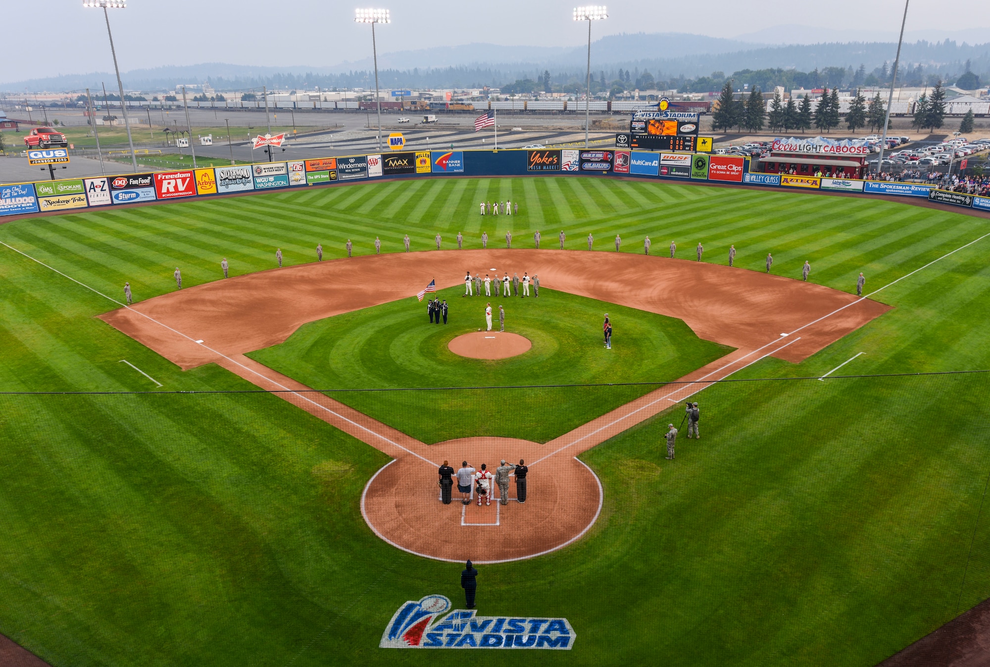 The Spokane Indians accompany Fairchild Airmen during Military Appreciation Night at Avista Stadium, Aug. 24, 2018, at Spokane Valley, Washington. On Military Appreciation Night, the Spokane Indians recognize and honor military members and their families’ dedication, commitment and sacrifices they have made for our nation. (U.S. Air Force photo/Tech. Sgt. John Ayre)