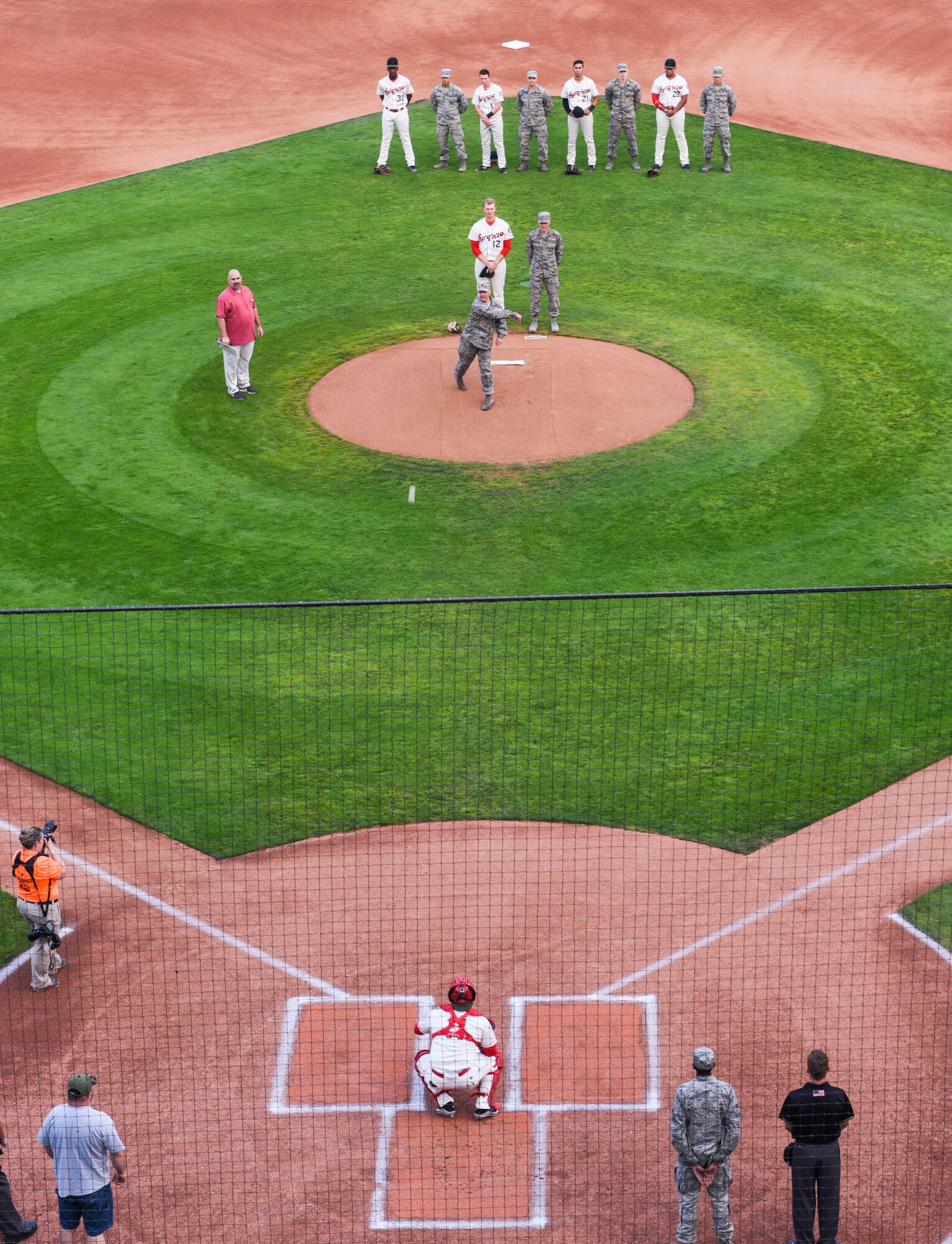 Col. Derek Salmi, 92nd Air Refueling Wing commander, throws the first pitch at the Spokane Indians game at Avista Stadium in Spokane, Wash., Aug. 24, 2018.