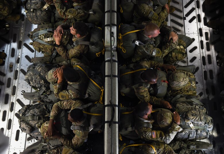 Paratroopers from the 82nd Airborne Division sit in a C-17 Globemaster III from McChord Field, Wash., during Exercise Predictable Iron near Pope Field, N.C., Aug. 21, 2018. Over the course of three days, Airmen form the 62nd Airlift Wing dropped 1,005 paratroopers during the exercise. (U.S. Air Force photo by Senior Airman Tryphena Mayhugh)