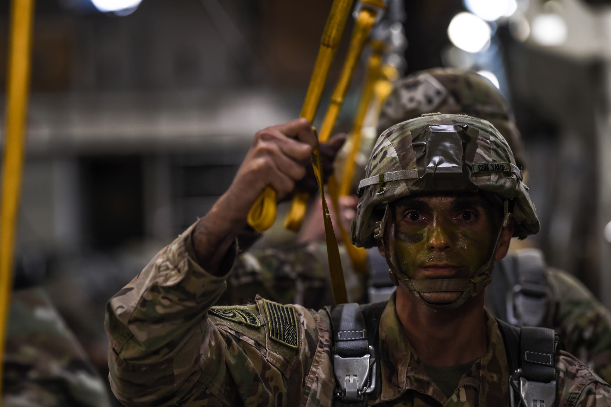 An 82nd Airborne Division paratroopers waits to jump out of a C-17 Globemaster III from McChord Field, Wash., during Exercise Predictable Iron near Pope Field, N.C., Aug. 21, 2018. Airmen from the 62nd Airlift Wing worked with the paratroopers during the exercise to help them maintain their airborne readiness requirements. (U.S. Air Force photo by Senior Airman Tryphena Mayhugh)