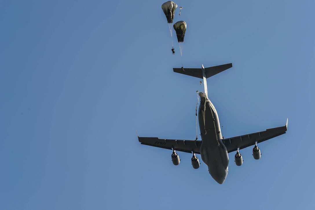 Paratroopers from the 82nd Airborne Division jump from a C-17 Globemaster III from McChord Field, Wash., during Exercise Predictable Iron at Pope Field, N.C., Aug 23, 2018. Airmen from the 62nd Airlift Wing dropped 1,005 paratroopers to keep the up-to-date with their airborne requirements. (U.S. Air Force photo by Senior Airman Tryphena Mayhugh)