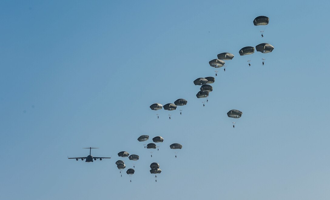 Paratroopers from the 82nd Airborne Division jump from a C-17 Globemaster III from McChord Field, Wash., during Exercise Predictable Iron at Pope Field, N.C., Aug 23, 2018. Over the course of three days, Airmen form the 62nd Airlift Wing dropped 1,005 paratroopers during the exercise. (U.S. Air Force photo by Senior Airman Tryphena Mayhugh)