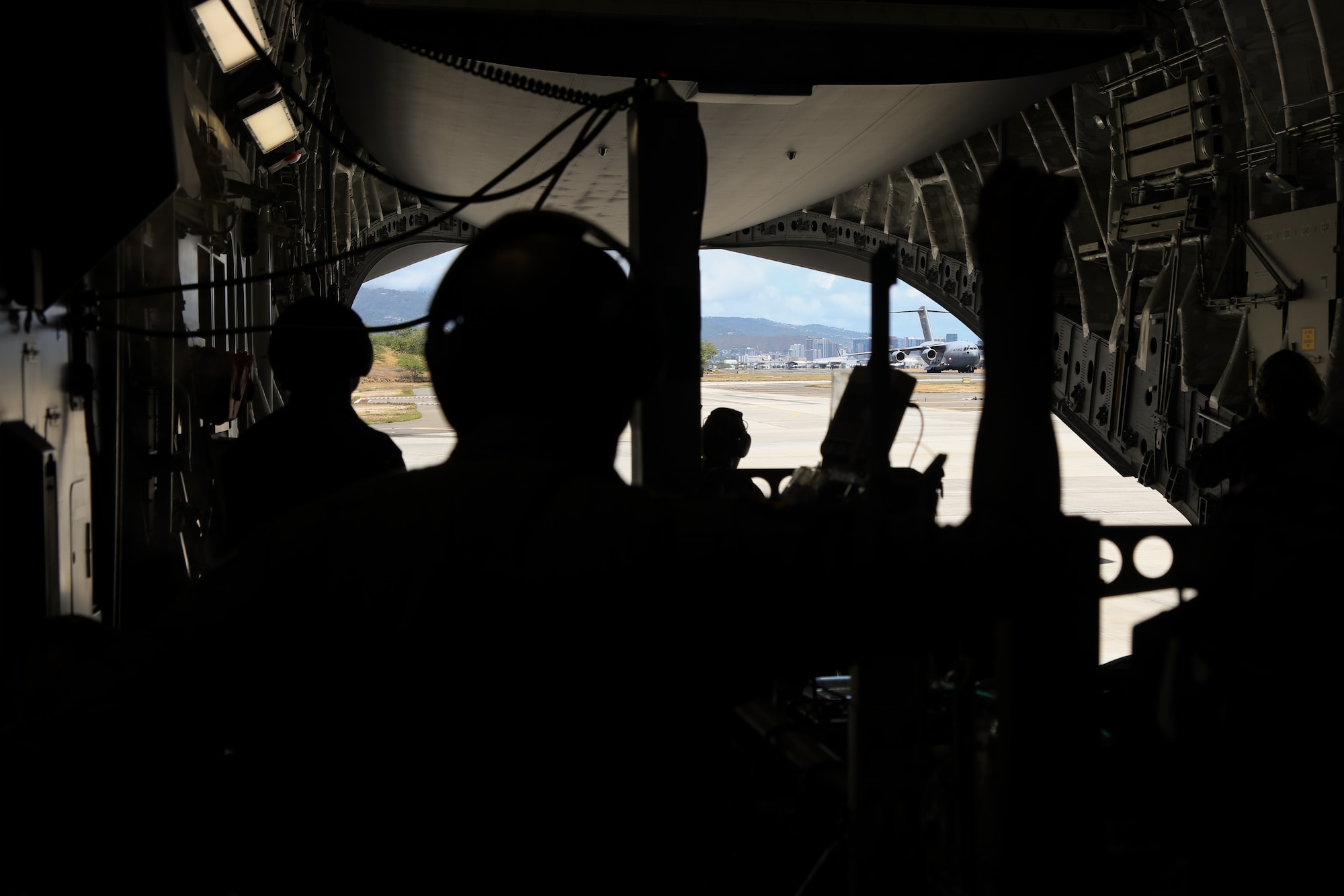 A C-17 Globemaster III carrying live mock causality patients from Joint Base Lewis – McChord lands at Joint Base Pearl Harbor - Hickam on July 9, 2018. Members of the 446th Aeromedical Squadron typically train with medical dummies, but for this training event used volunteers from the U.S. Army and U.S. Air Force. (U.S. Air Force photo by David L. Yost)