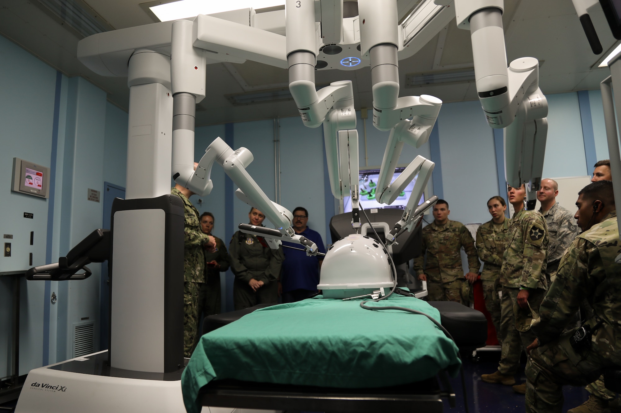 Combined training event participants listen to an explanation of some of the capabilities of the USNS Mercy on July 9, 2018, on Joint Base Pearl Harbor – Hickam. The hospital ship is unique in that it has a robot surgeon aboard. (U.S. Air Force photo by David L. Yost)